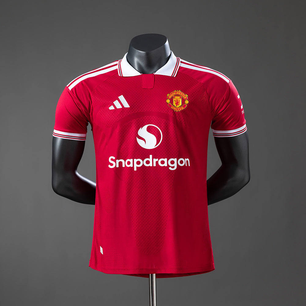 MANCHESTER UNITED VERSIÓN JUGADOR LOCAL 26-27